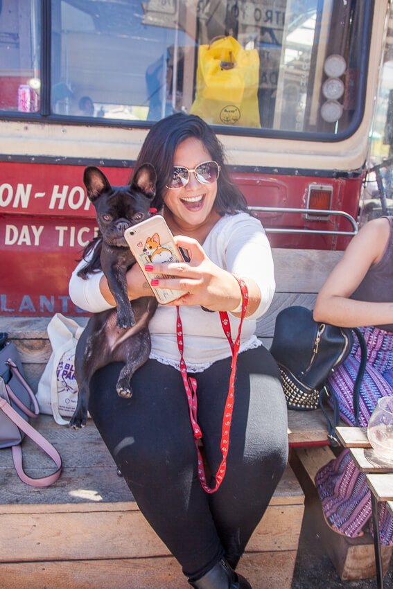 Women taking a selfie with her frenchie