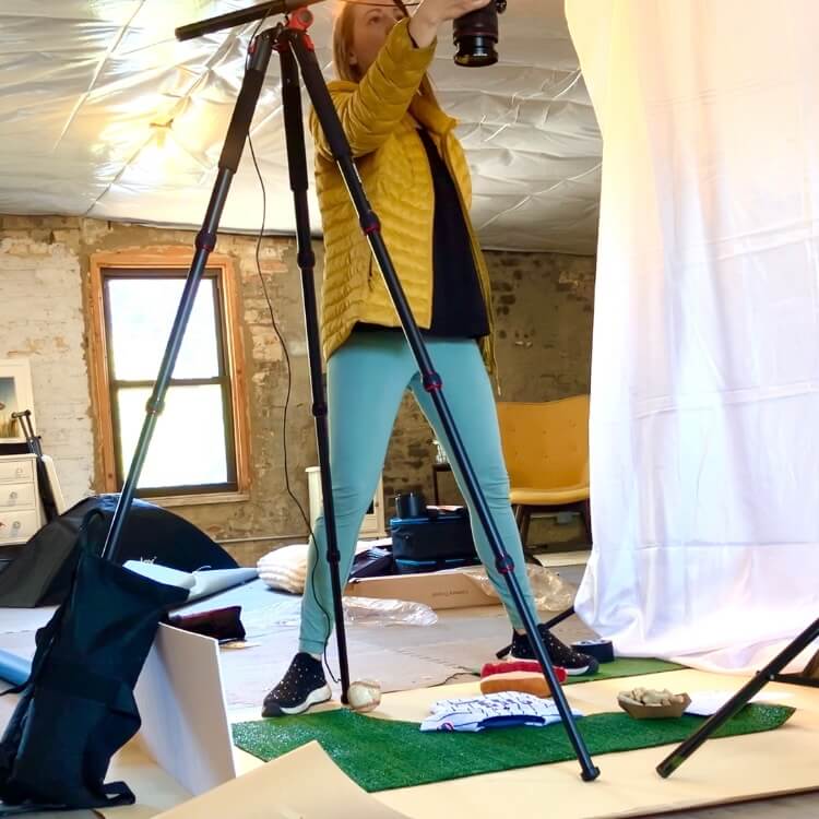 BTS photo of photographer for overhead product shot.